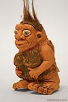 A weird cavewoman finger puppet toy