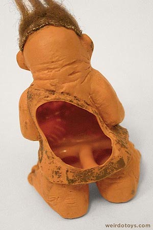 A weird cavewoman finger puppet toy
